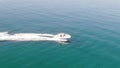 Chase with the drone camera of an inflatable sofa on the water. Unusually calm, without the slightest wave, like a lake, the Medit