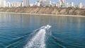 Chase with the drone camera of an inflatable sofa on the water. Unusually calm, without the slightest wave, like a lake, the Medit