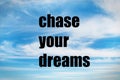 Chase your dreams quote on sky Royalty Free Stock Photo