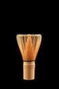 Chasen or Bamboo tea whisk on black background, close-up. Accessory for whipping Matcha tea