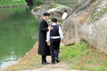 2 chasid boys in traditional clothes walk in the park in Uman, Ukraine.