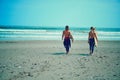 Chasing waves is our top priority. a young couple walking on the beach with their surfboards. Royalty Free Stock Photo