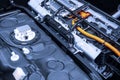 Chassis of the electric car with powertrain and power connections closeup. Blue toned. EV car drivetrain at maintenance. Royalty Free Stock Photo