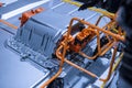 Chassis of the electric car with powertrain and power connections closeup. Blue toned. EV car drivetrain at maintenance. Royalty Free Stock Photo