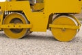 The chassis of a large yellow rink making the road Royalty Free Stock Photo