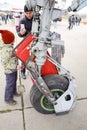 Chassis of a military aircraft. Child at the wheel of the chassis. Su-35 fighter at the air show. Aircraft on the airfield to show