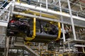 The chassis of a Vauxhall Astra suspended on the production line of the Vauxhall factory at Ellesmere Port Cheshire July 2011