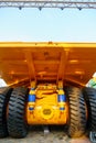 Chassis with wheels for commercial cargo transportation. Traffic safety. A large black rough tire for trucks. Working in a quarry Royalty Free Stock Photo