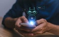 Chat with AI, Artificial Intelligence. Man using a smartphone chatting with an intelligent artificial intelligence asks for the