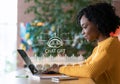 Cheerful african american woman using chat gpt on laptop