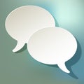 Chat speech bubbles ellipse vector white on a blue bokeh background. Royalty Free Stock Photo