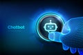 Chatbot assistant application. AI concept. Closeup finger about to press a button with robot chatbot head icon. Just push the Royalty Free Stock Photo