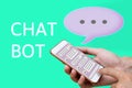 Chatbot concept. social media mesh and man using chatting on smart phone