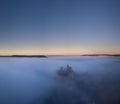 Chateau Beynac in fog in the early morning Perigord Noir Dordogne France Royalty Free Stock Photo