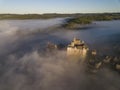 Chateau Beynac in fog in the early morning Perigord Noir Dordogne France Royalty Free Stock Photo