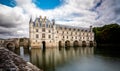 Chateau de Chenonceau over peaceful river waters.