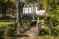 Chateau Gaillard Amboise surrounded by forest park with small bridge over a little stream on the foreground. Loire valley, France. Royalty Free Stock Photo