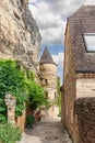 Chateau Manoir de Tarde dominates in heart of La Roque-Gageac village with its slate-topped tower. Dordogne department Royalty Free Stock Photo