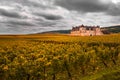 Chateau with vineyards in the autumn season, Burgundy, France Royalty Free Stock Photo