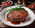 A Chateaubriand beef steak with grill strips is on a plate