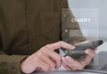 ChatGPT Chat with AI or Artificial Intelligence technology. businessman using smartphone chatting with intelligent artificial