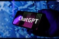 ChatGPT OpenAI logo on smartphone in conceptual Artificial intelligence futuristic background