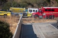 Firetrucks and crews from LACFD and VCFD arrive on scene to fight a brushfire