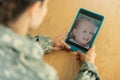 Mature woman chatting with daughter using tablet