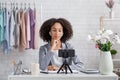 Chatting with followers online during coronavirus outbreak. Serious african american woman with wireless headphones Royalty Free Stock Photo