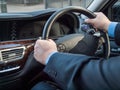 Chauffeur's hands Royalty Free Stock Photo