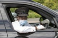 Chauffeur wearing a mask during the Covid-19 outbreak.