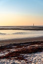 Chauveau lighthouse, isle of Re, at sunrise during low tide. Royalty Free Stock Photo