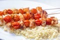 chcicken meat and tomato skewers with couscous Royalty Free Stock Photo