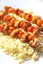 chcicken meat and tomato skewers with couscous Royalty Free Stock Photo