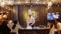 Cheaf Frying Food in Asian Restaurant with Open Kitchen in front of Customers. 4K. Bangkok, Thailand - 23 DEC 2017.