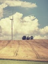 Cheap energy. Wind energy turbines in field with blue sky Royalty Free Stock Photo