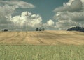 Cheap energy. Wind energy turbines in field with blue sky