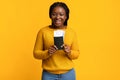 Cheap Flights. Excited Black Lady Holding Passport And Tickets On Yellow Background Royalty Free Stock Photo