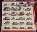 Cheap silver rings in box. Flea market Royalty Free Stock Photo