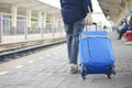 Cheap Travel and Lifestyle concept. Holiday Time, Young Solo Traveler woman wearing jeans and walking at train station. Asian Royalty Free Stock Photo