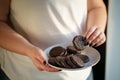 Diet breakdown. overweight woman eating sweets