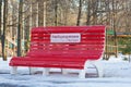 Cheboksary Russia - 10 December 2019: The Big red bench in winter park in Lakreevskiy forest. Translation: Free for ours, Family Royalty Free Stock Photo