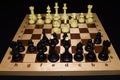 Chechered board with black pawns as a strategy backdrop Royalty Free Stock Photo
