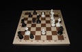 Chechered board with white chessmen as a skill backdrop Royalty Free Stock Photo