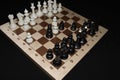 Chechered board and white pieces for game concept Royalty Free Stock Photo