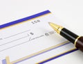 Closeup of blank check and pen Royalty Free Stock Photo