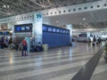 Check-in Area with Passengers Inside the Milan Malpensa Airport Facility in Italy