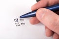 Decision-Making: Close-Up of Hand Checking Yes on Checkboxes