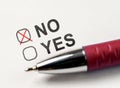 Check boxes yes or no on white paper. Checking No Box. checkbox NO. marked with red cross and pen on white paper background. Royalty Free Stock Photo