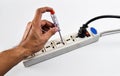 Check electric current with voltage testing screwdriver in neutral socket Royalty Free Stock Photo